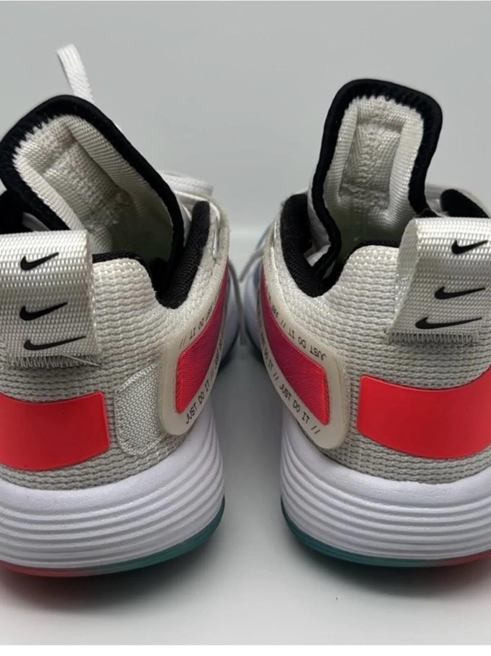 Nike White Volleyball/Basketball Shoes with Blue and Pink Accents